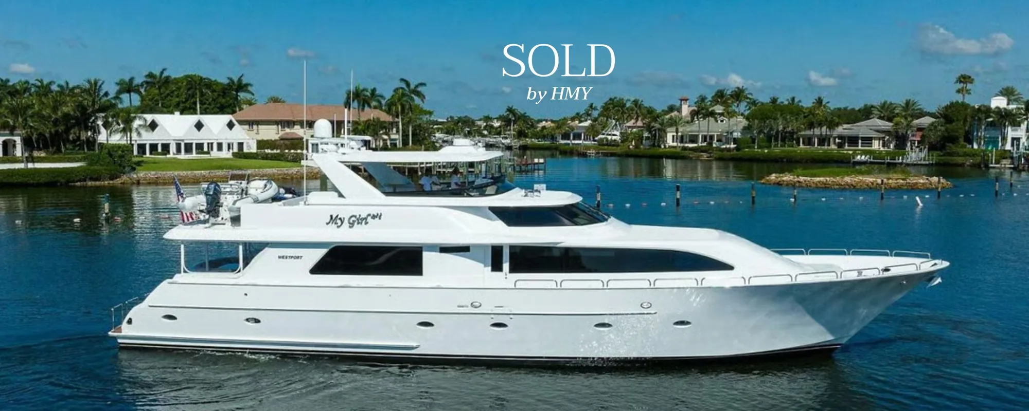 The 2001 Westport 95 motor yacht “My Girl” at anchor on calm water, marked sold by HMY Yacht Sales.