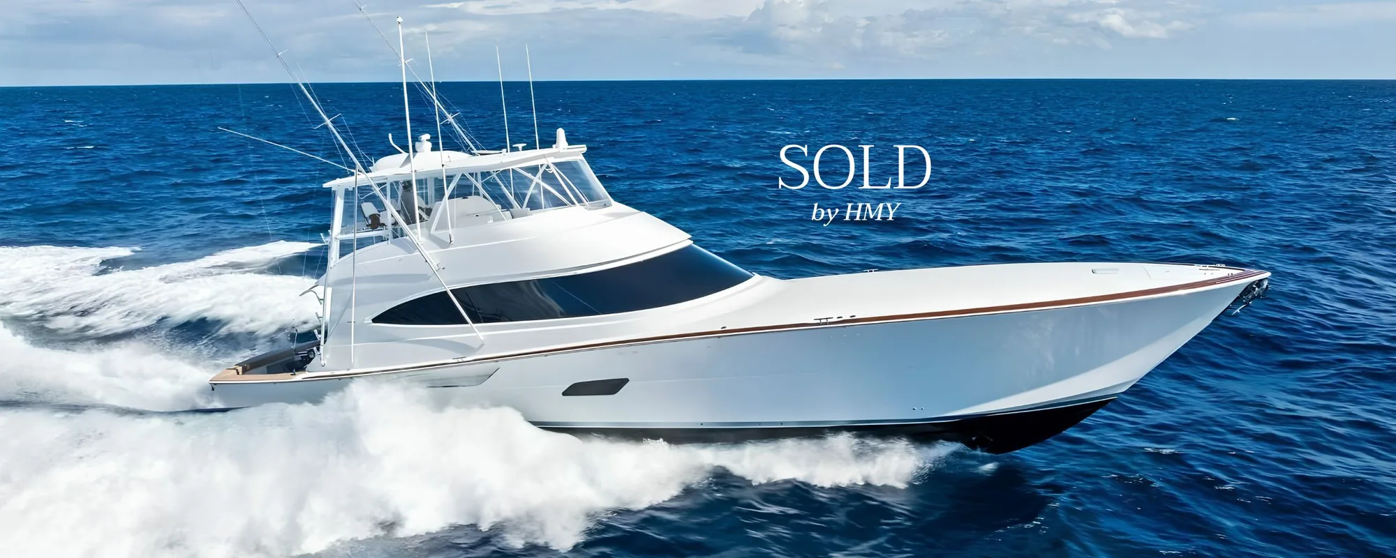 A 2026 Viking 82 Convertible sportfishing yacht running offshore, marked sold by HMY Yacht Sales.