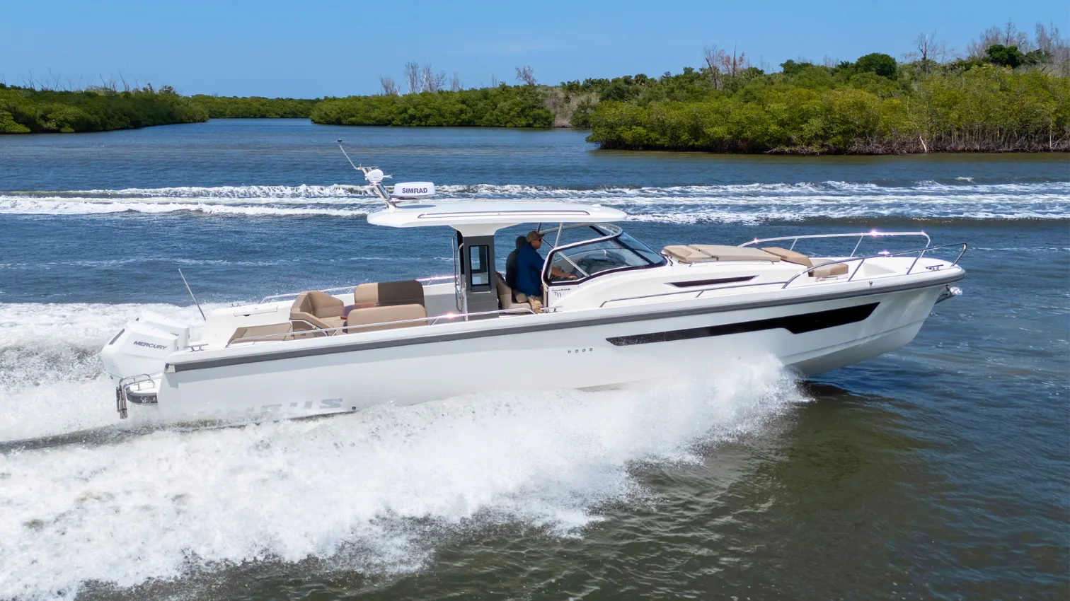 Nimbus T11 day boat running on the Intracoastal, full profile view with a clean wake.