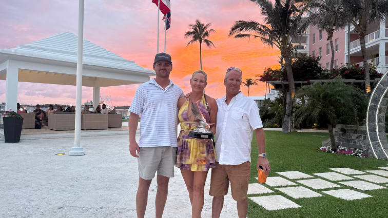 Bobbi with her 1st place lady angler award at the Bermuda Triple Crown along side her husband Tram and her son Trammy